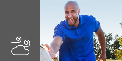 Bald man with beard and blue shirt
