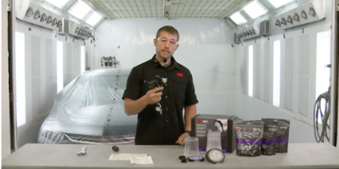 image of person standing holding the 3M™ Precision Spray Gun
