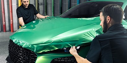 Workers applying protection wrap film
