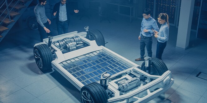Team of Automotive Engineers Working on Electric Car

