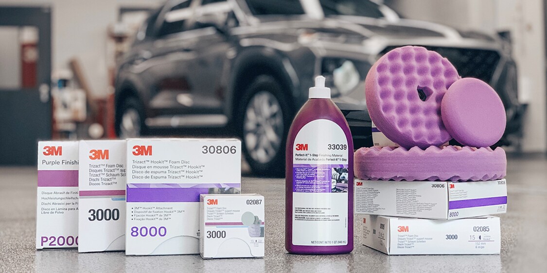 Picture showing the Perfect-It 1-Step Paint Finishing System abrasives, finishing material, and purple foam finishing pads
