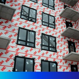 Image of a building with 3M™ air barrier showing before the final exterior is applied