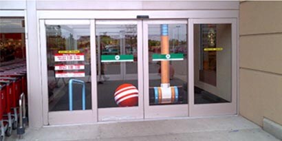 Clear glass automatic doors with seasonal wall graphics using 3M wall graphic films.
