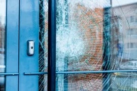 A video shows two criminals trying to break through a ground floor window, but they are deterred by 3MTM Safety and Security Window Films and 3MTM Impact Protection Attachment Systems.