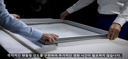 A person holding a white rectangular object