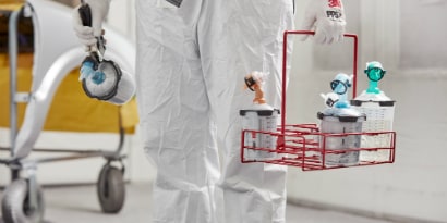Paint Technician walking towards paint booth
