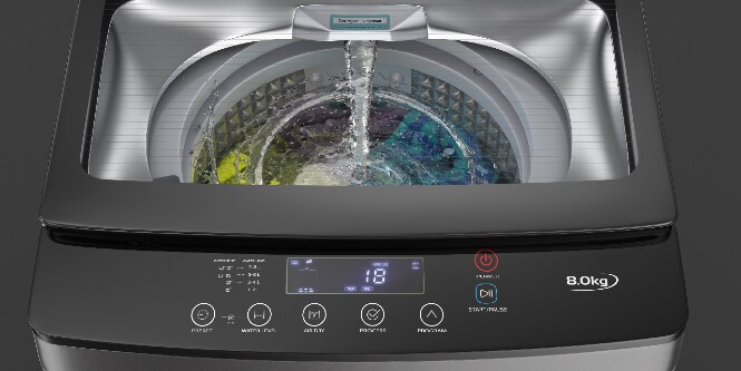 Image of the view through the clear lid of a top-loading clothes washer
