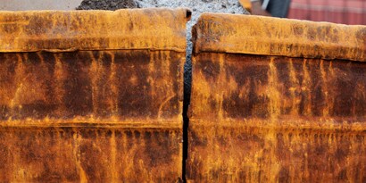 Adhering to rusty iron can be challenging; surface preparation can impact adhesive effectiveness.
