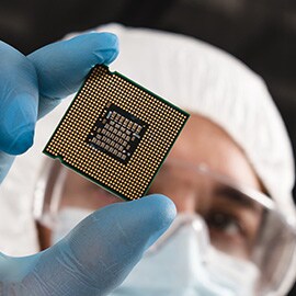 person holding a microchip