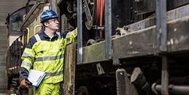 Image of a worker with clipboard performing an inspection

