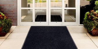 light duty floor mat at building front door entrance
