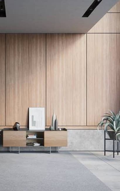 room with a wood wall and a table
