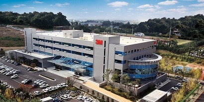 A building with a parking lot
