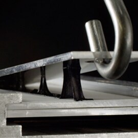 3M VHB tape reworkability lab test showing the clean removal and disassembly with 3M electronics bonding solutions.