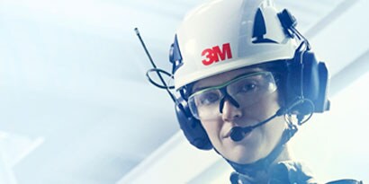 worker wearing head, eye, and hearing protection
