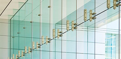 Large floor to ceiling windows in a commercial interior.
