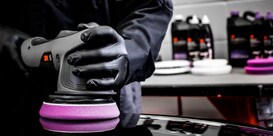 A person working on a car
