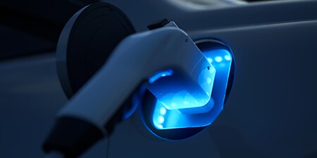 Electric car battery charging in the dark
