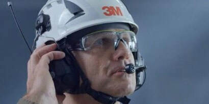 sideview of worker with 3M eyewear, hard hat, and comms
