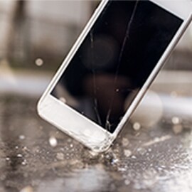 phone being smashed on a table