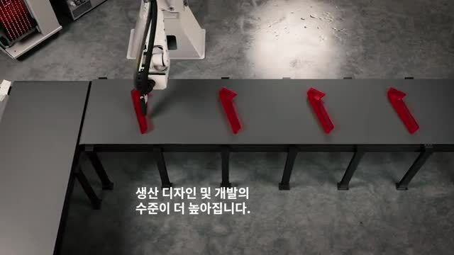 A robot arm holding red objects
