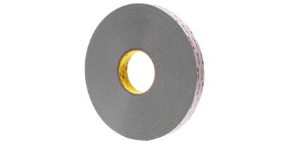 A roll of tape with red text
