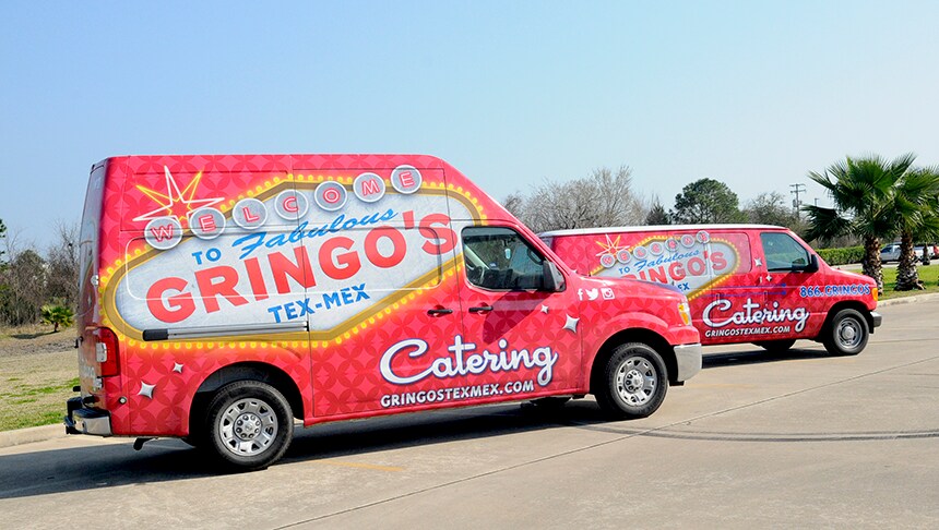 group of red trucks with white text
