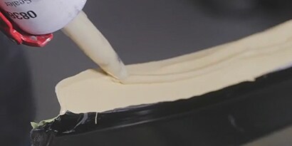 applying seam sealer as part of welding process
