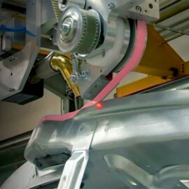 Robotic application of structural adhesive tape for automotive