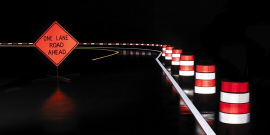 A road sign on a road
