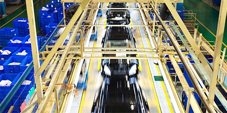 fully assembled car on assembly line
