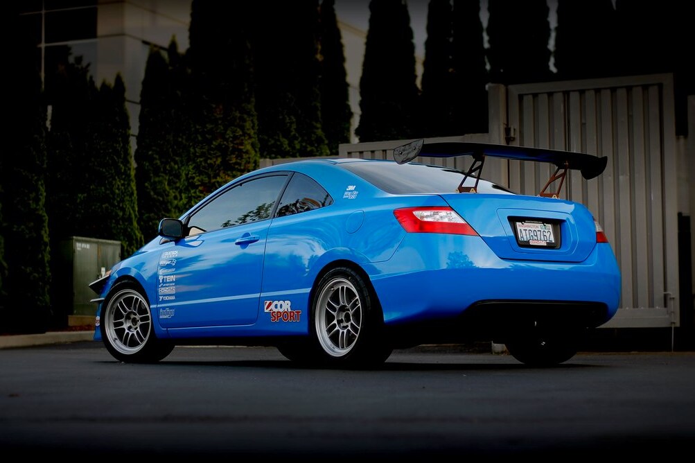 blue car parked on the road
