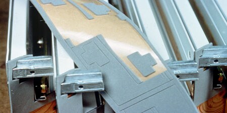 Die-cut foam adhesive material coming off line
