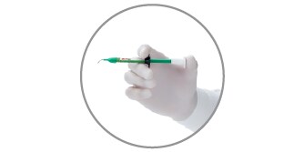 hand holding syringe

