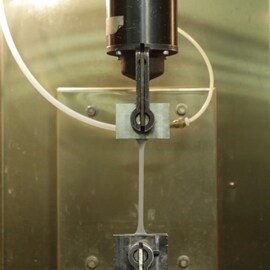 Example of electronics bonding solutions heat resistance with tensile elongation test and 3M's VHB tapes versus adhesives.