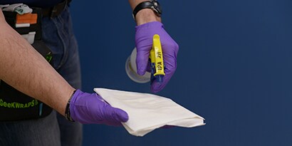 Peeling down 3M low-VOC paint wall graphic of soda can with condensation
